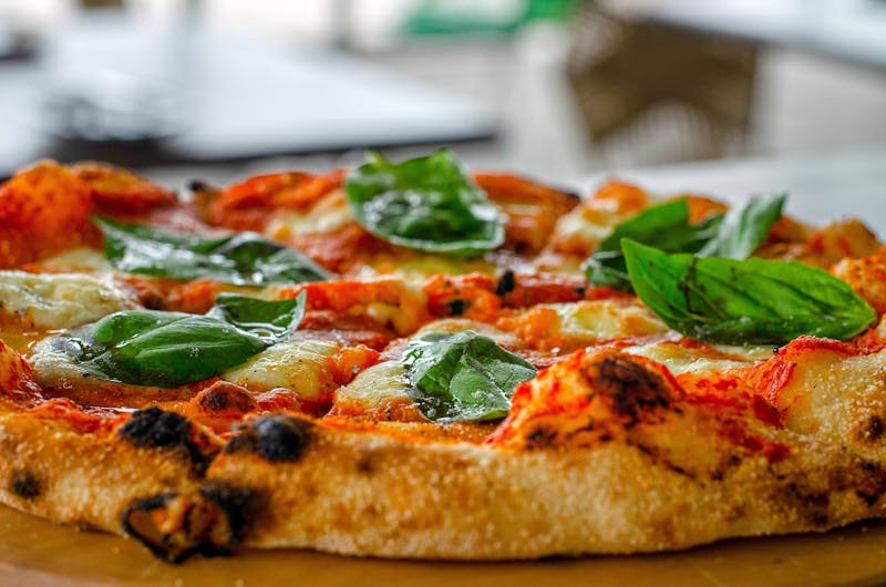 Classic Margherita mod pizza with fresh basil